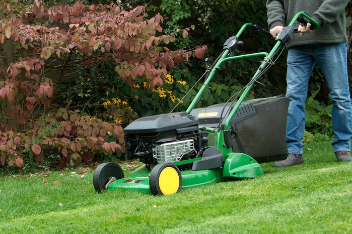Mowing a lawn Mowing a lawn